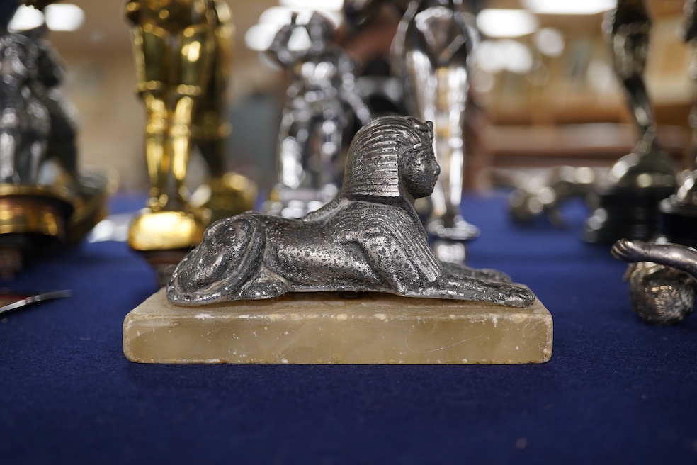 Eight figural chrome and brass car mascots, etc. including a knight in full armour mounted on a threaded radiator cap, a sphinx mounted on a threaded radiator cap, plus an additional sphinx mounted on an alabaster plinth